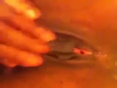 In this close-up dilettante film, I'm fingering myself in the brown cooter.